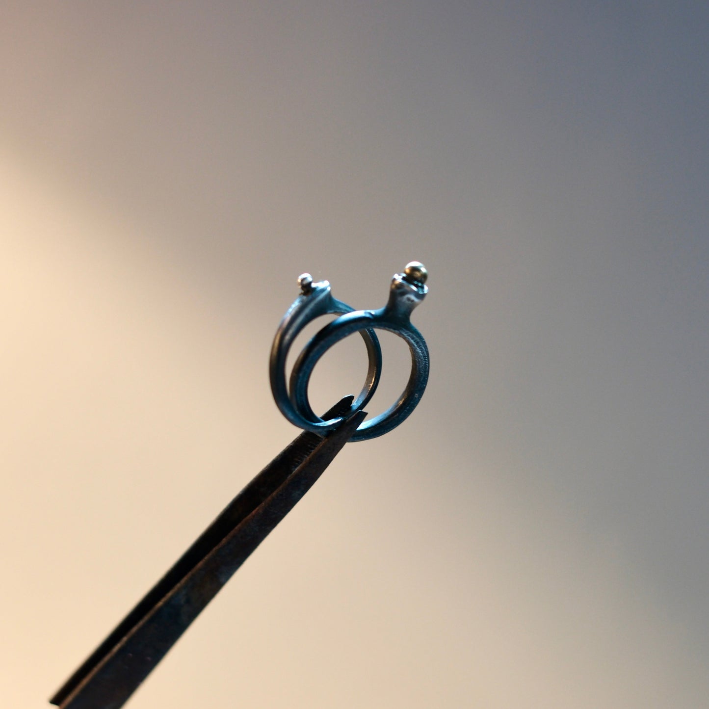 Twisted Double Band Ring with a Brass or Golden Droplet